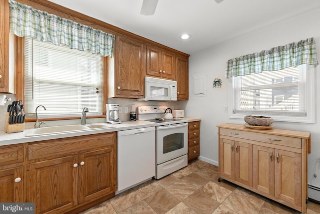 10 E 16th St, Long Beach Township, NJ 08008 - kitchen featuring white appliances, a sink, a baseboard heating unit, light countertops, and recessed lighting
