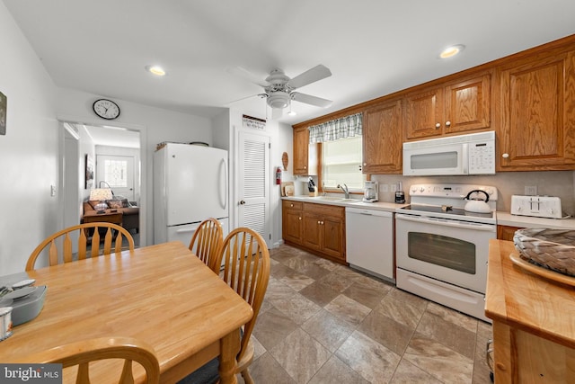 10 E 16th St, Long Beach Township, NJ 08008 - kitchen with white appliances, light countertops, recessed lighting, a ceiling fan, and brown cabinets
