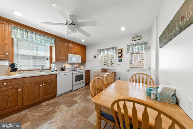 10 E 16th St, Long Beach Township, NJ 08008 - kitchen with white appliances, a sink, healthy amount of natural light, brown cabinets, and recessed lighting