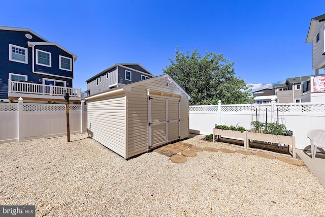 10 E 16th St, Long Beach Township, NJ 08008 - view of shed with a vegetable garden and a fenced backyard