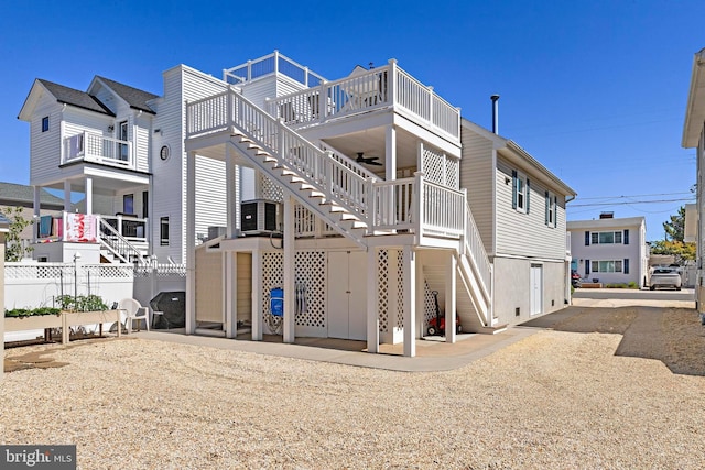 10 E 16th St, Long Beach Township, NJ 08008 - rear view of property featuring stairway and a wooden deck