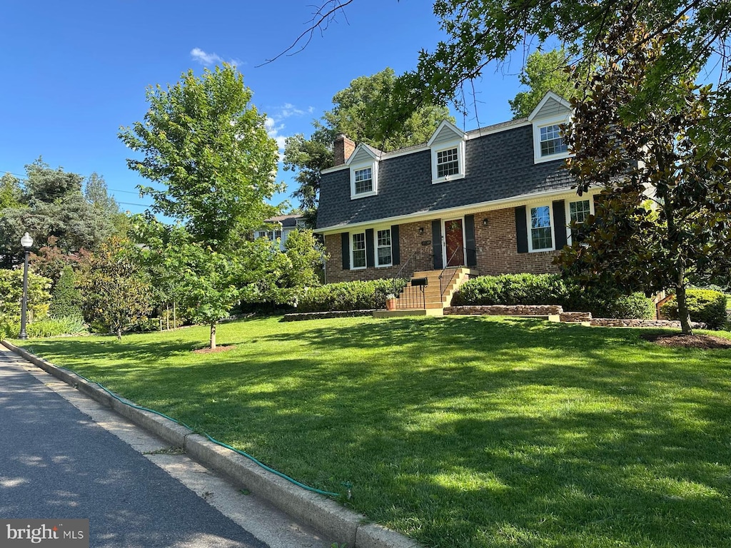 3930 6th St S, Arlington, VA 22204 - view of front of property featuring a shingled roof, brick siding, a front lawn, and a chimney