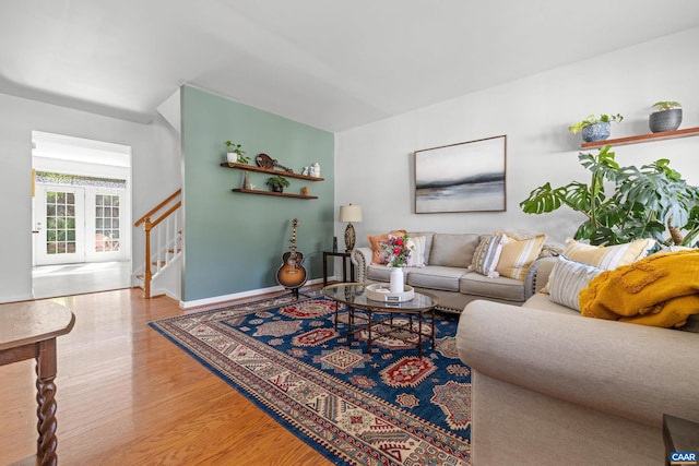 4760 Bluejay Way, Charlottesville, VA 22911 - living room with wood finished floors, stairway, and baseboards