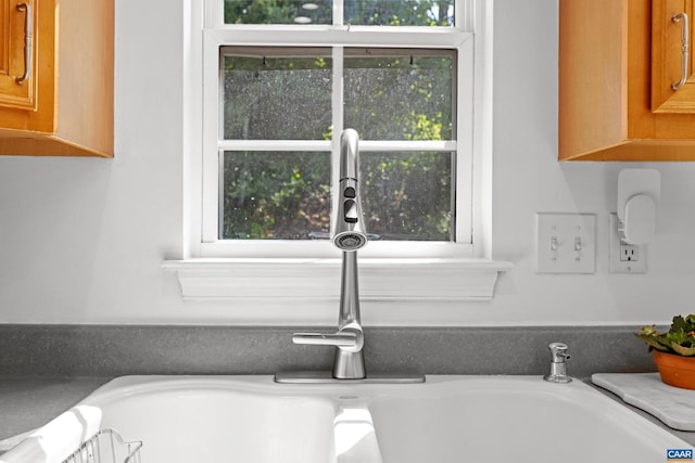 4760 Bluejay Way, Charlottesville, VA 22911 - kitchen view of a sink and brown cabinetry