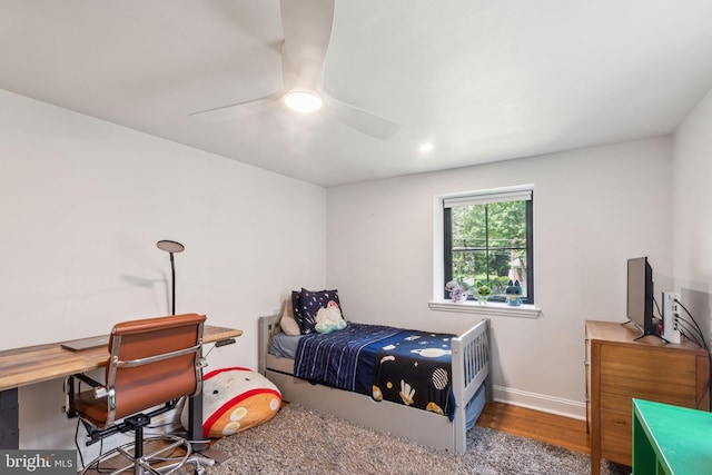 137 Sutton Rd, Ardmore, PA 19003 - bedroom featuring an office area, baseboards, wood finished floors, and a ceiling fan