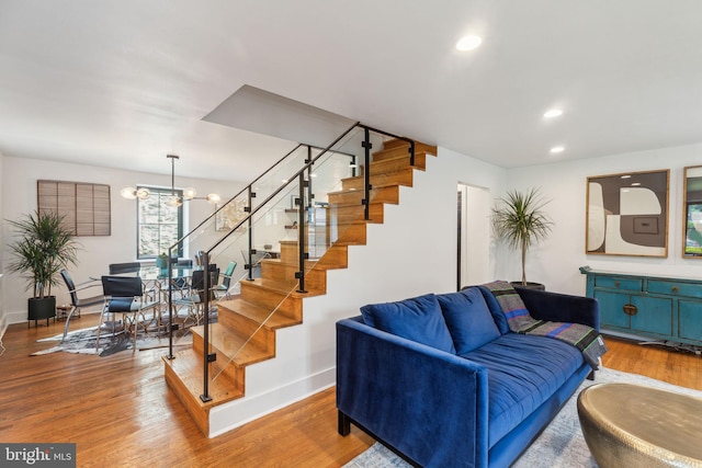 137 Sutton Rd, Ardmore, PA 19003 - living room with stairway, a chandelier, baseboards, wood finished floors, and recessed lighting
