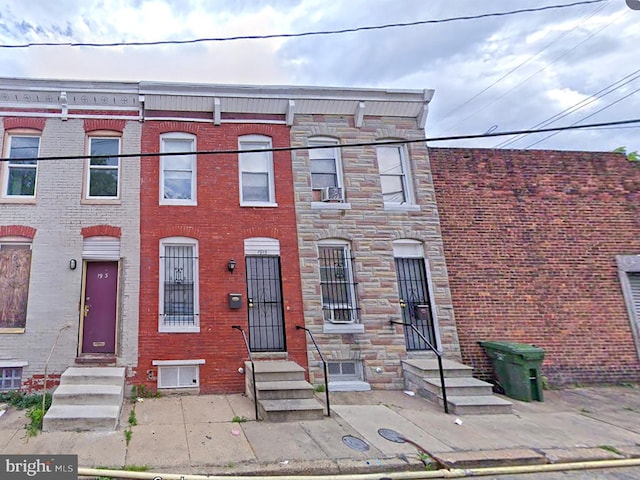 1917 Lemmon St, Baltimore, MD 21223 - view of property featuring entry steps, stone siding, and brick siding