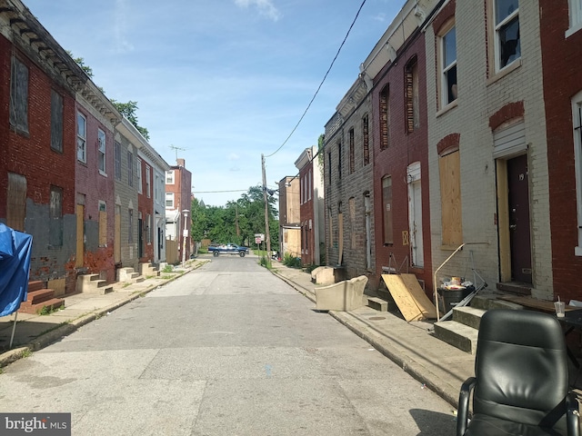 1917 Lemmon St, Baltimore, MD 21223 - view of asphalt alley with curbs, sidewalks, and a residential view