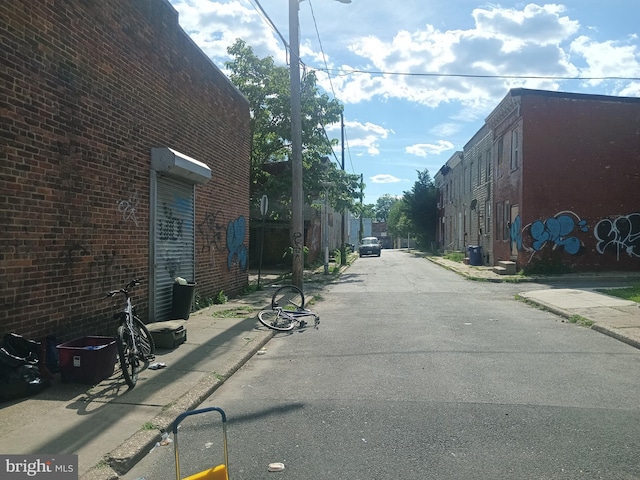 1917 Lemmon St, Baltimore, MD 21223 - view of asphalt alley with curbs and sidewalks