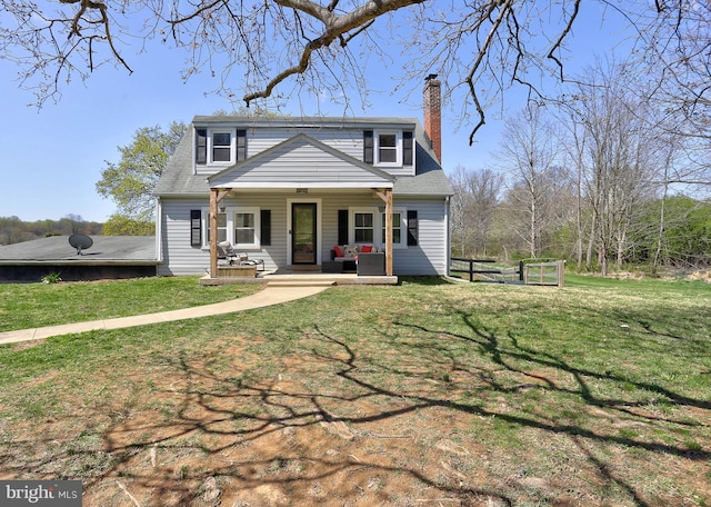 3530 Baker Rd, Westminster, MD 21157 - traditional-style home with a chimney, a front lawn, and an outdoor hangout area