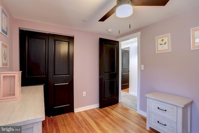 3530 Baker Rd, Westminster, MD 21157 - unfurnished bedroom featuring light wood-style floors, baseboards, a closet, and a ceiling fan