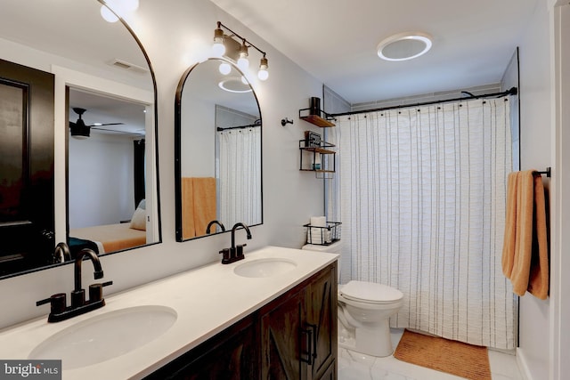 3530 Baker Rd, Westminster, MD 21157 - full bath with double vanity, toilet, and a ceiling fan