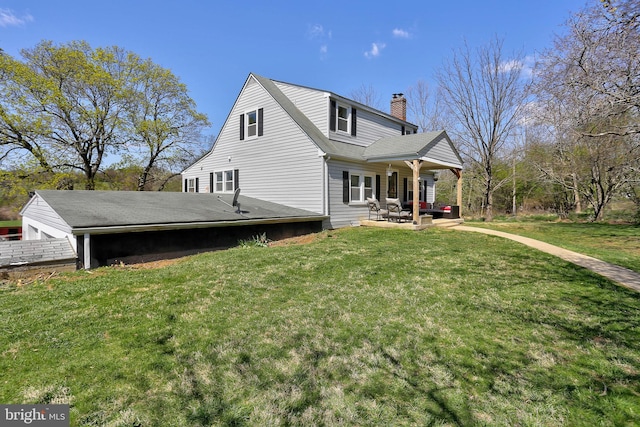 3530 Baker Rd, Westminster, MD 21157 - back of property with a chimney, a yard, and a patio area