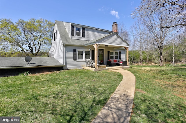 3530 Baker Rd, Westminster, MD 21157 - view of front of property with an outdoor living space, a chimney, a front lawn, and a patio