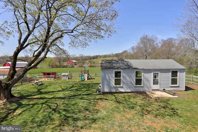 3530 Baker Rd, Westminster, MD 21157 - back of house with a playground, an outbuilding, and a shingled roof