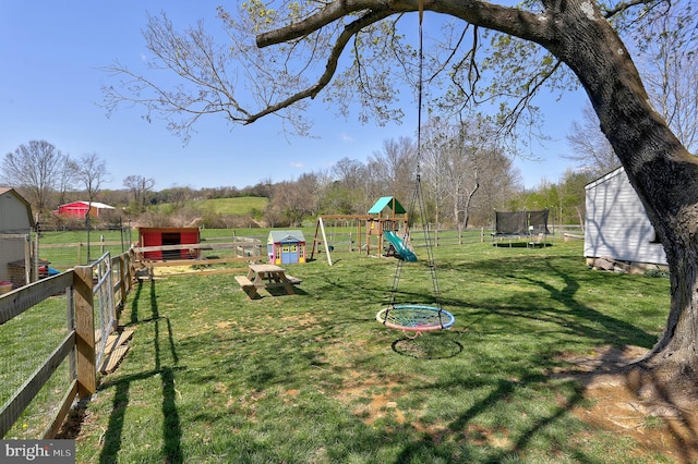 3530 Baker Rd, Westminster, MD 21157 - view of yard featuring a trampoline, a playground, and an outbuilding