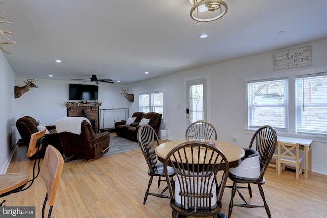 3530 Baker Rd, Westminster, MD 21157 - dining room featuring light wood-style floors, a brick fireplace, a ceiling fan, recessed lighting, and baseboards
