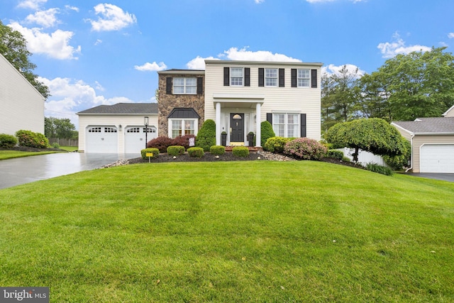 7 Seedling Dr, Holland, PA 18966 - view of front of home with driveway, a front lawn, and an attached garage
