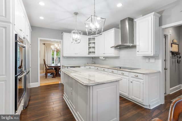 7 Seedling Dr, Holland, PA 18966 - kitchen with wall chimney exhaust hood, a chandelier, decorative backsplash, black electric cooktop, and recessed lighting