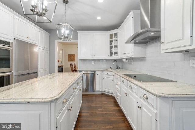 7 Seedling Dr, Holland, PA 18966 - kitchen with wall chimney exhaust hood, a chandelier, stainless steel appliances, white cabinetry, and recessed lighting