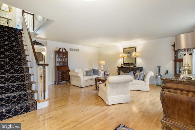7 Seedling Dr, Holland, PA 18966 - living room featuring stairs, light wood-type flooring, and ornamental molding
