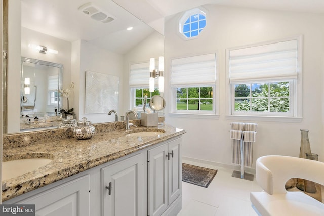 7 Seedling Dr, Holland, PA 18966 - bathroom with vaulted ceiling, double vanity, a freestanding bath, tile patterned flooring, and baseboards