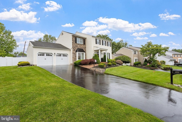 7 Seedling Dr, Holland, PA 18966 - view of front of home with driveway, an attached garage, and stone siding