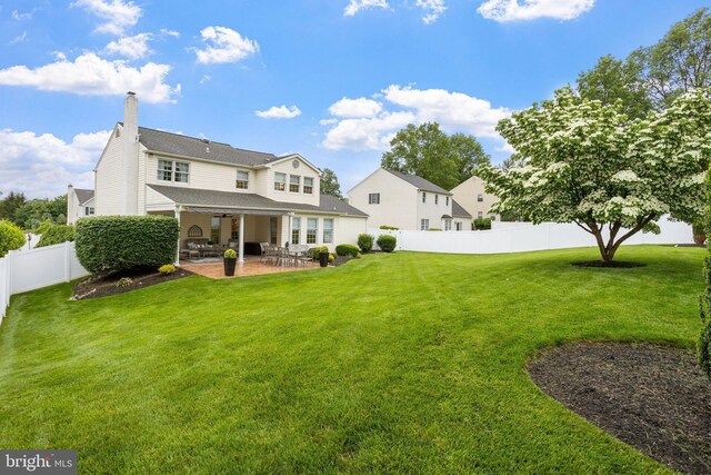 7 Seedling Dr, Holland, PA 18966 - rear view of house with a patio area and a chimney