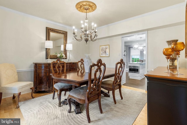 7 Seedling Dr, Holland, PA 18966 - dining space with a chandelier, light wood-style flooring, crown molding, and baseboards