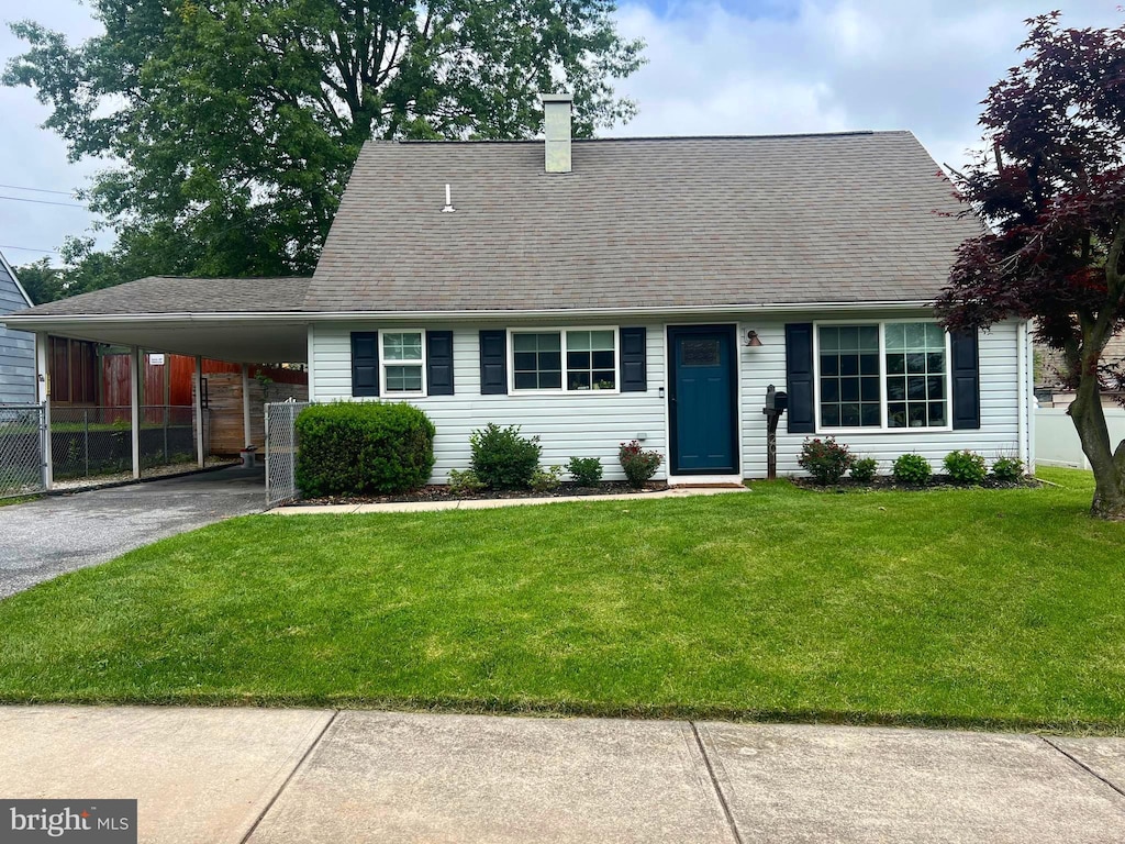 201 Aspen St, Middletown, PA 17057 - view of front of property with driveway, an attached carport, a chimney, and roof with shingles