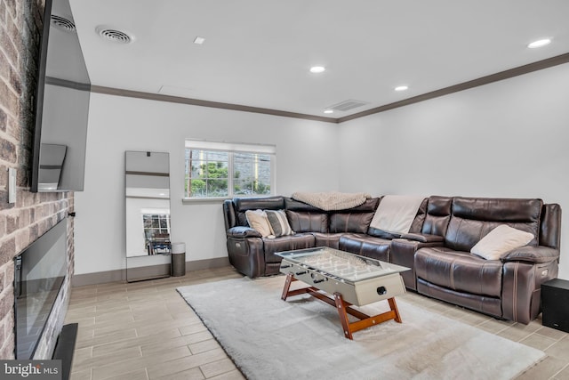 201 Aspen St, Middletown, PA 17057 - living area with ornamental molding, a fireplace, recessed lighting, and baseboards