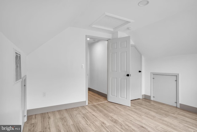201 Aspen St, Middletown, PA 17057 - additional living space with vaulted ceiling, attic access, and light wood-style floors