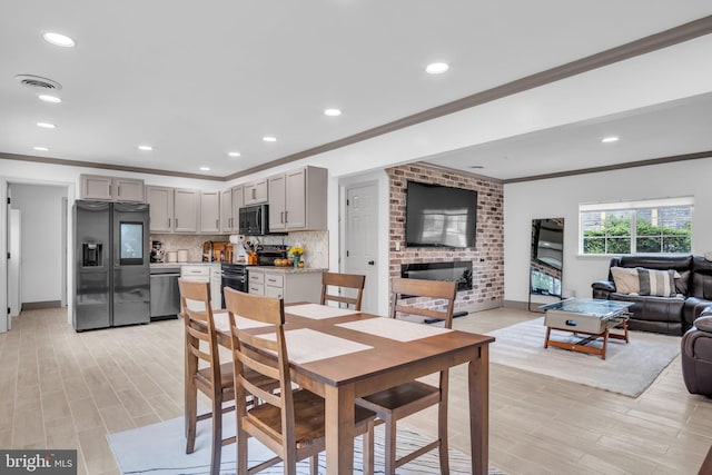201 Aspen St, Middletown, PA 17057 - dining space with crown molding, light wood finished floors, recessed lighting, and baseboards