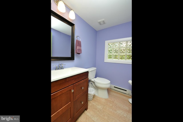 439 Landing St, Lumberton, NJ 08048 - bathroom featuring a baseboard heating unit, vanity, toilet, and wood finished floors