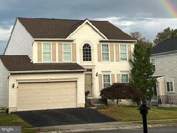 57 Foxwell Bend Rd, Glen Burnie, MD 21061 - view of front facade with asphalt driveway and an attached garage