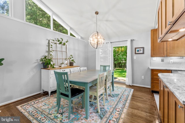 5209 Stonington Dr, Fairfax, VA 22032 - dining area featuring a chandelier, dark wood-style floors, baseboards, and lofted ceiling