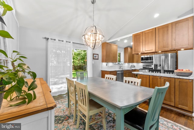 5209 Stonington Dr, Fairfax, VA 22032 - dining area with a chandelier, lofted ceiling, dark wood-style floors, and recessed lighting