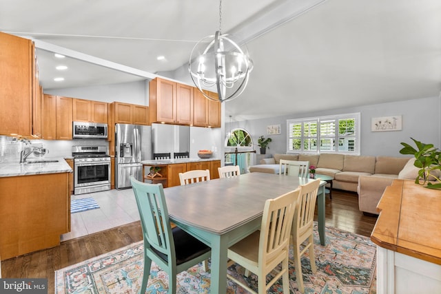 5209 Stonington Dr, Fairfax, VA 22032 - dining room featuring a chandelier and light wood-style floors
