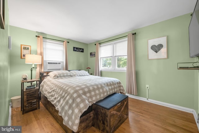 145 Nursery Ave, Levittown, PA 19057 - bedroom featuring wood finished floors, baseboards, and cooling unit