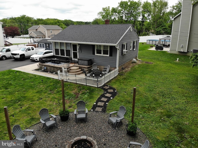 145 Nursery Ave, Levittown, PA 19057 - rear view of house with a fire pit, a chimney, and a shingled roof