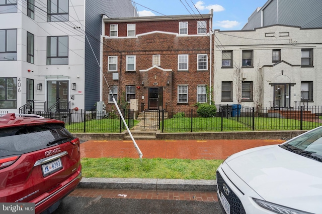 408 Kennedy St NW Unit 202, Washington, DC 20011 - view of front of home with brick siding and a fenced front yard