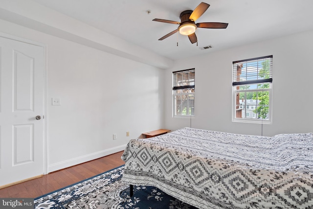 408 Kennedy St NW Unit 202, Washington, DC 20011 - bedroom with wood finished floors, baseboards, and ceiling fan