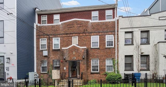 408 Kennedy St NW Unit 202, Washington, DC 20011 - townhome / multi-family property featuring brick siding and a fenced front yard