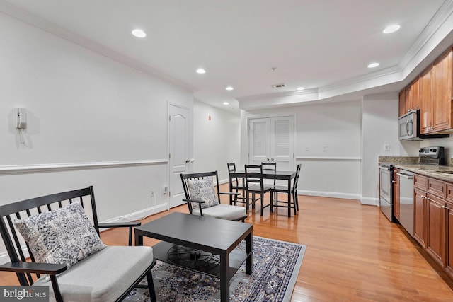 408 Kennedy St NW Unit 202, Washington, DC 20011 - living area featuring ornamental molding, light wood-type flooring, recessed lighting, and baseboards