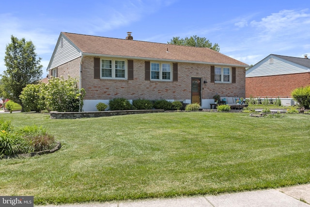 6 Trevett Blvd, Newark, DE 19702 - bi-level home with brick siding, a front yard, and a chimney