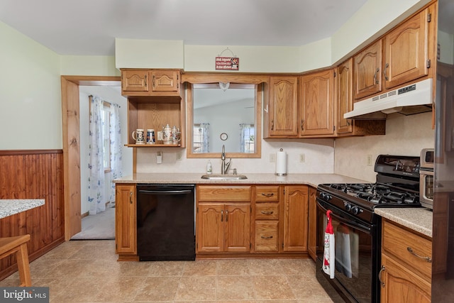 6 Trevett Blvd, Newark, DE 19702 - kitchen featuring black appliances, under cabinet range hood, a sink, light countertops, and brown cabinets