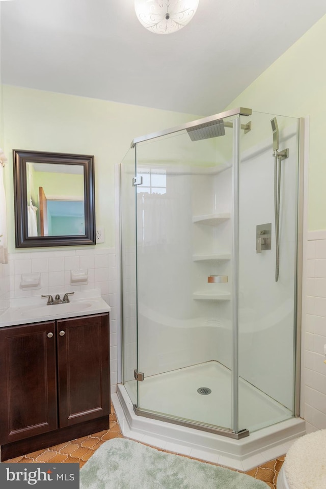 6 Trevett Blvd, Newark, DE 19702 - full bathroom with tile walls, a stall shower, vanity, tile patterned floors, and wainscoting