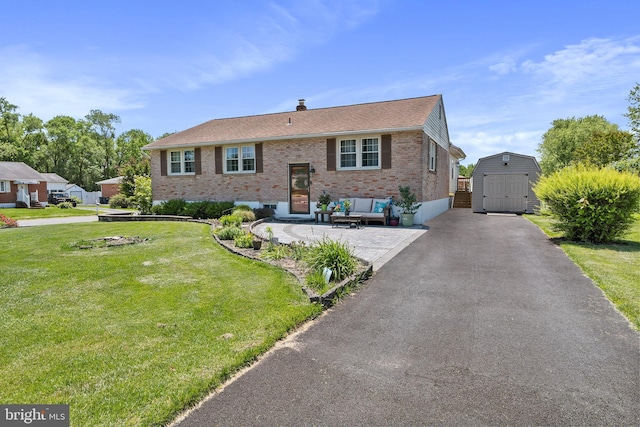 6 Trevett Blvd, Newark, DE 19702 - bi-level home featuring brick siding, a front lawn, outdoor lounge area, a patio area, and roof with shingles