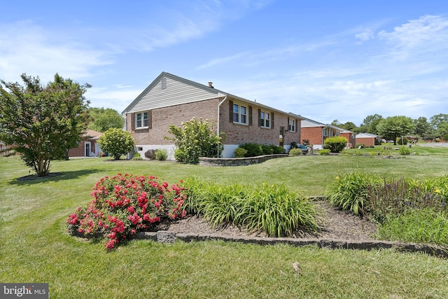 6 Trevett Blvd, Newark, DE 19702 - view of property exterior featuring brick siding and a yard