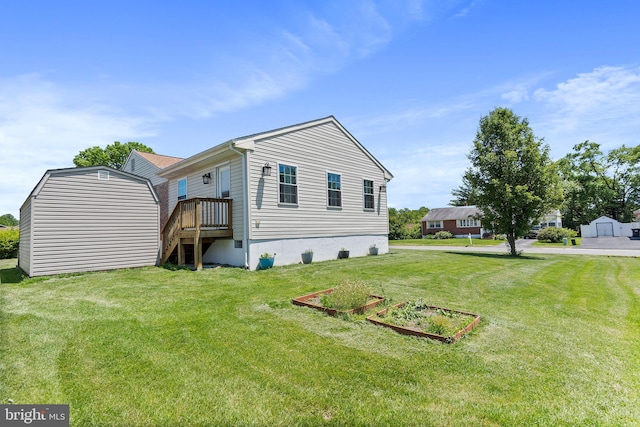 6 Trevett Blvd, Newark, DE 19702 - back of house featuring a lawn and a vegetable garden
